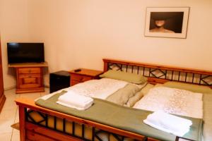 Кровать или кровати в номере Moderne Landwohnung - in Toplage