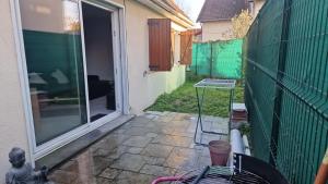 an outside view of a door of a house at Joli appart à 10mn de paris in Bezons