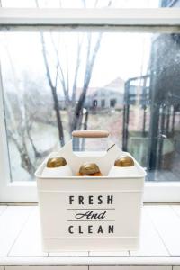 a box of fresh and clean donuts in a window at Farmville Modern Loft in Farmville