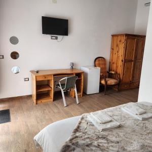 TV a/nebo společenská místnost v ubytování Iloghe di Marras