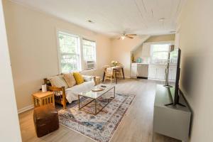 a living room with a couch and a table at Kinston Hideaway in Kinston