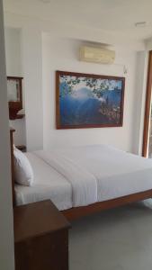 Postel nebo postele na pokoji v ubytování Oruwa Turtle Beach Villa