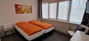 Postel nebo postele na pokoji v ubytování Hotel B&B Seahorse