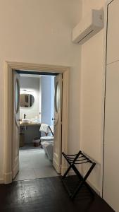 a white bathroom with a toilet and a sink at Re Nasone Rooms in Naples in Naples