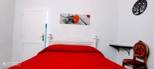 A bed or beds in a room at DIMORA IL CAMALEONTE apartments in nature with pool