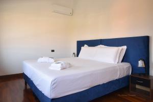 Postel nebo postele na pokoji v ubytování Welc-oM Villa Noventa Padovana