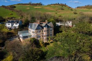 an aerial view of a mansion in the hills at Westwell Hall in Ilfracombe
