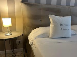 Cama ou camas em um quarto em B&B Baciami Ancora