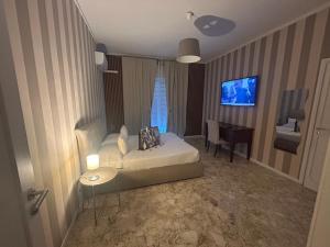 Cama ou camas em um quarto em B&B Baciami Ancora