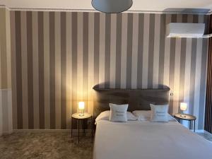 Cama ou camas em um quarto em B&B Baciami Ancora