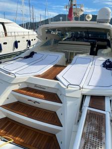 a boat with two openartments on the deck at Yacht Cantieri Sarnico 60 feet in Cannigione