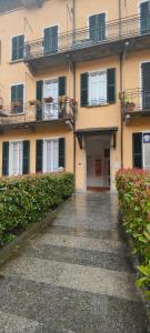 a building with a wet street in front of it at La Sosta Domodossola in Domodossola