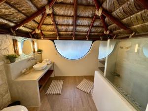 a bathroom with a tub and a sink and a shower at Mantra Baja, Boutique Hotel in Los Barriles