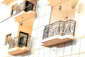a close up of two balconies on a building at Home By Dina'Sty in Yaoundé