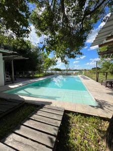 a swimming pool in the yard of a house at Momocho in Esquina