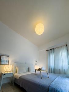 Postel nebo postele na pokoji v ubytování Nectar Apartments