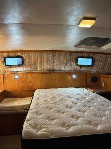 a large bed in the back of a boat at Annapolis Boat Life - Overnight Stays in Annapolis