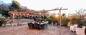 A garden outside DIMORA IL CAMALEONTE apartments in nature with pool