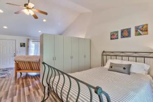 a bedroom with a bed and a ceiling fan at Private Cottage Near Scenic Deschutes River Woods! in Bend