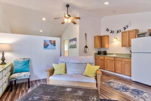 a kitchen with a couch and a refrigerator at Private Cottage Near Scenic Deschutes River Woods! in Bend