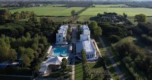 an aerial view of a house with a pool at Medea Beach Resort - Cultural Stay near Amalfi Coast & Paestum in Paestum