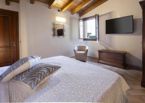 A bed or beds in a room at Agriturismo Il Brugnolo