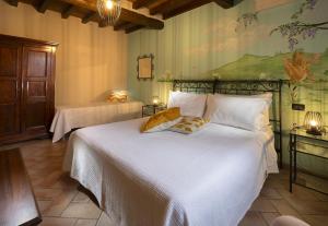 A bed or beds in a room at Agriturismo Il Brugnolo