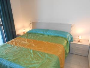 Ένα ή περισσότερα κρεβάτια σε δωμάτιο στο Ferienhaus direkt am Meer mit Wallbox für Elektroautos