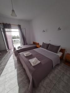 Postel nebo postele na pokoji v ubytování VILLA VRACHOS Preveza