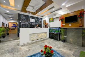 a lobby of a fish store with a fish tank at Hotel Gloory Suites Near Delhi Airport in New Delhi