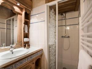 a bathroom with a sink and a shower at Appartement de standing à Courchevel 1850 avec cheminée et accès ski aux pieds - FR-1-575-2 in Courchevel