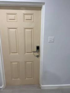 a door in the corner of a room at Chez Rose Bungalow in Nassau