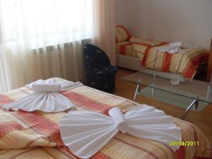 מיטה או מיטות בחדר ב-Hotel Gazei