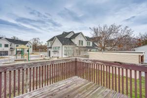 a backyard with a wooden fence and houses at Salt Lake County Home Near 4 Major Ski Resorts! in Midvale