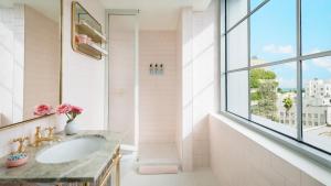 a bathroom with a sink and a window at The Goodtime Hotel, Miami Beach a Tribute Portfolio Hotel in Miami Beach