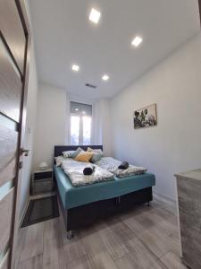 Katil atau katil-katil dalam bilik di Napfény apartman