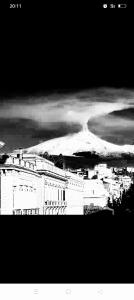 a black and white photo of a snow covered mountain at Villa Laura Apartment in Giardini Naxos