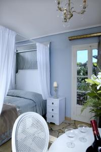 A bed or beds in a room at Dafnoudi Hotel Apartments