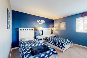 Postel nebo postele na pokoji v ubytování Bayside Resort - 11444 West Sand Cove