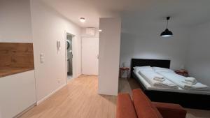Posteľ alebo postele v izbe v ubytovaní 1,5 room Apartment with terrace, new building, B1
