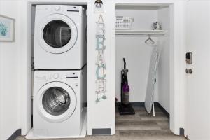 a laundry room with a washer and dryer at Sea Palm 1D condo in Fort Walton Beach