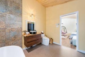 a bathroom with a sink and a mirror at Cozy and beautiful chalet in Harrington