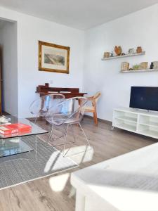 a living room with two chairs and a table at Panoramic views to the sea in Malaga in Málaga