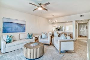a living room with a couch and a table at Hp 422 Blue Haven in Rosemary Beach