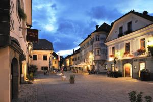 an empty street in a town with buildings at Pension Lectar in Radovljica