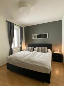 Postel nebo postele na pokoji v ubytování Boutique-Hotel Antica Posta
