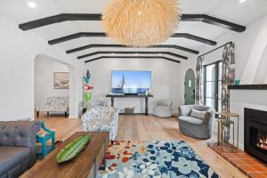 a living room with a couch and a piano at Spanish Villa with View Pool and Spa in San Diego