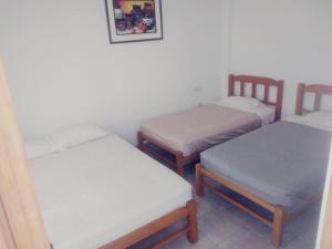 Ένα ή περισσότερα κρεβάτια σε δωμάτιο στο HOSPEDAJE PARACAS SUR