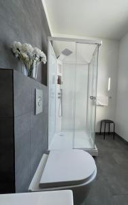 a bathroom with a glass shower and a toilet at Bjork Guesthouse in Laugarvatn