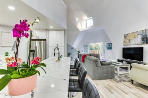 a kitchen and living room with white walls at Modern Escondido Home with Furnished Deck, Fire Pit! in Escondido